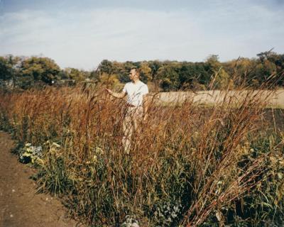 Ray Schulenberg in fall prairie with big bluestem