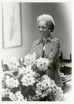 Helen Langrill behind bouquet of flowers 