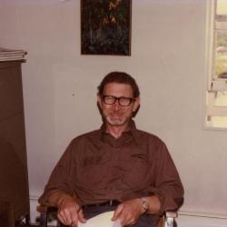 Charles Lewis at desk