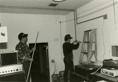 Dennis Liby and assistant working in Thornhill Audubon Room projection booth