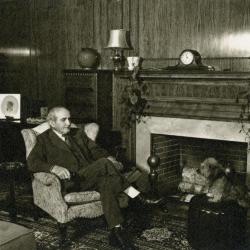 Mark Morton Christmas Card, sitting by fireplace at his residence on North Ave.