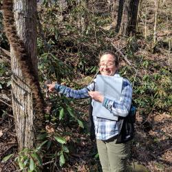 Kim Shearer with large poison ivy vine, North Carolina