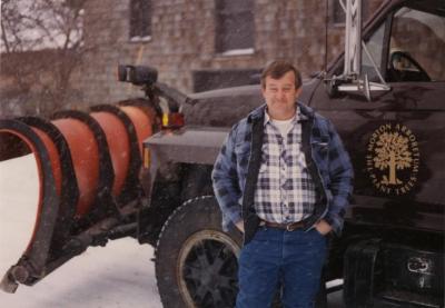 Doug Monroe with Arboretum vehicle in winter