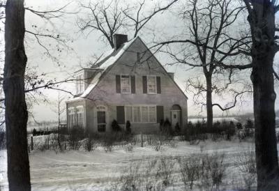 Clarence Godshalk's first Arboretum house in winter, front exterior view, facing on old Joliet Road