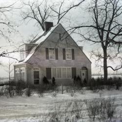 Clarence Godshalk's first Arboretum house in winter, front exterior view, facing on old Joliet Road