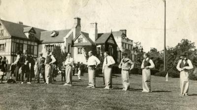 Men lined up for sack race with Thornhill residence behind