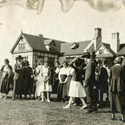 Group standing in lawn with Thornhill residence behind