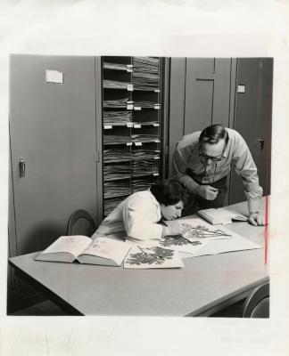 Ray Schulenberg with Cathy Ciolac studying specimens in Herbarium 