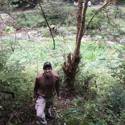Matt Lobdell standing near Corylus fargesii (paperbark hazelnut)