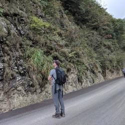 Andrew Gapinski examining roadside vegetation