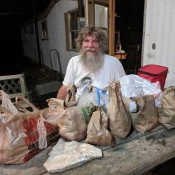 Tim Thibault with bags of walnuts