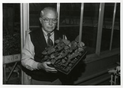 George Ware holding seedlings from China Collection