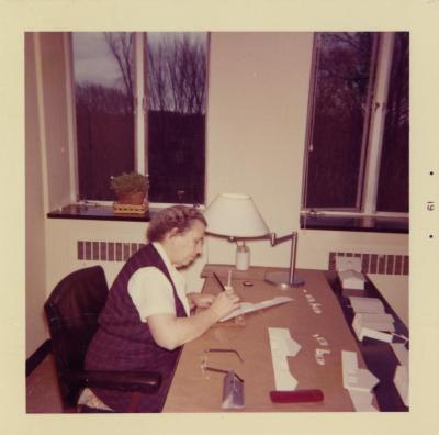 Helen Turner in office at desk