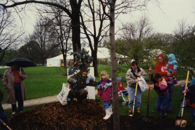 Arbor Day, Carolyn Finzer dressed as Morton Oak with child during tree planting