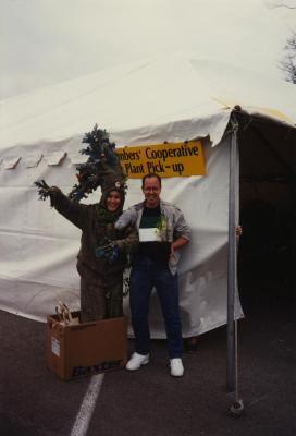 Arbor Day, Carolyn Finzer dressed as Morton Oak and Mike Spravka at the members' cooperative plant pickup tent