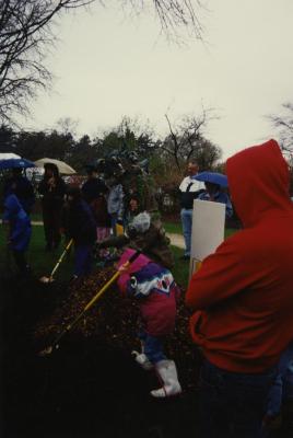 Arbor Day, group watching children and Carolyn Finzer dressed as Morton Oak plant tree