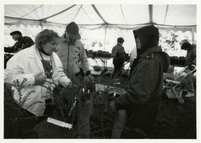 Arbor Day, Lynne Kalata (on the right)  assisting visitors at Surplus Plant Sale