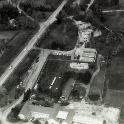 Aerial view of Administration Building, greenhouses, nursery, South Farm