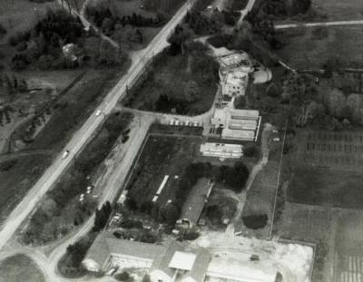 Aerial view of Administration Building, greenhouses, nursery, South Farm