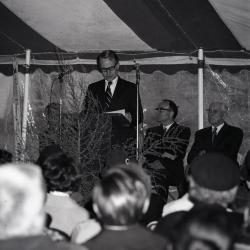 Arbor Day Centennial, tree planting afternoon program, James Olson at podium speaking to seated guests in tent on J. Sterling Morton, founder of Arbor Day