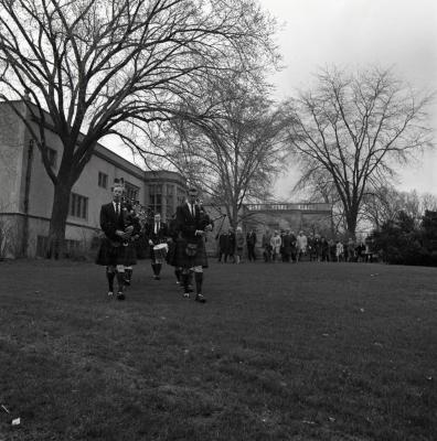 Arbor Day Centennial, tree planting afternoon program, Shannon Rovers pipe band playing bagpipes leading processional from Thornhill across lawn behind Founder's Room